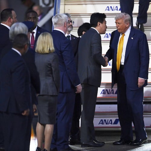 President Donald Trump is welcomed by Japan's newly appointed Chief Cabinet Secretary Minoru Kihara upon arrival at Haneda Tokyo International Airport in Tokyo, Japan, Monday, Oct. 27, 2025, (David Mareuil/Pool Photo via AP)