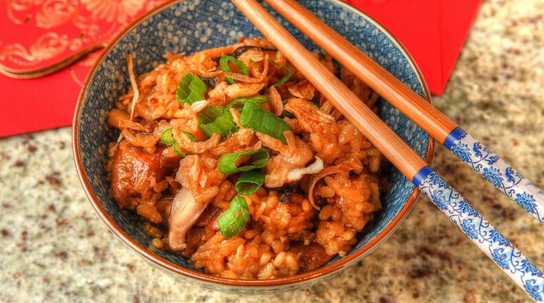 Sticky Rice with Chicken, Mushrooms and Chinese Sausage, made from a family recipe from Jennifer McCormick, is one of the dishes that’s perfect for a Lunar New Year’s celebration. STYLING BY JENNIFER MCCORMICK / CONTRIBUTED BY CHRIS HUNT PHOTOGRAPHY