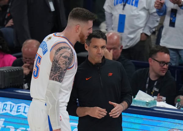 Oklahoma City Thunder center Isaiah Hartenstein (55) talks with head coach Mark Daigneault during the second half of Game 1 of the NBA Finals basketball series against the Indiana Pacers Thursday, June 5, 2025, in Oklahoma City. (AP Photo/Nate Billings)