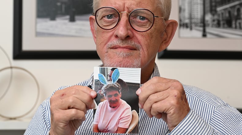 Charles Milne holding a photograph of his sister Leona Milne, who died without receiving CPR after she stopped breathing at her Marietta nursing home. Leona Milne had signed a do-not-resuscitate order, but a family lawsuit alleges that it was not done properly. (Hyosub Shin / Hyosub.Shin@ajc.com)