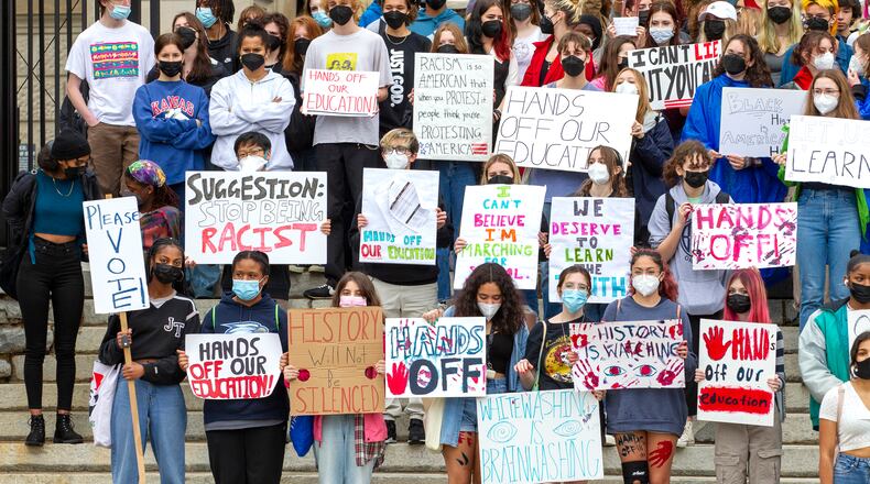 Students pose for a photo on the steps of the state Capitol while protesting what they call censorship legislation Friday, Feb. 25, 2022. (Steve Schaefer for The Atlanta Journal-Constitution)