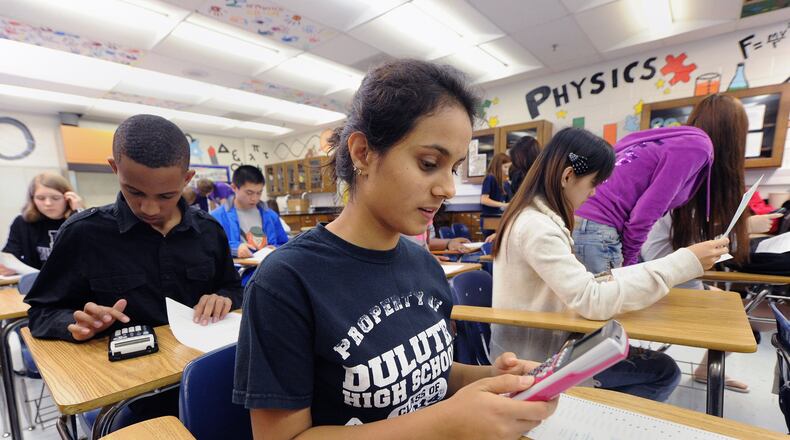 Many students, like these in an AP physics class, sit for final exams at the end of the courses that determine whether they earn college credits for their efforts. In the wake of the coronavirus, those tests are moving online.