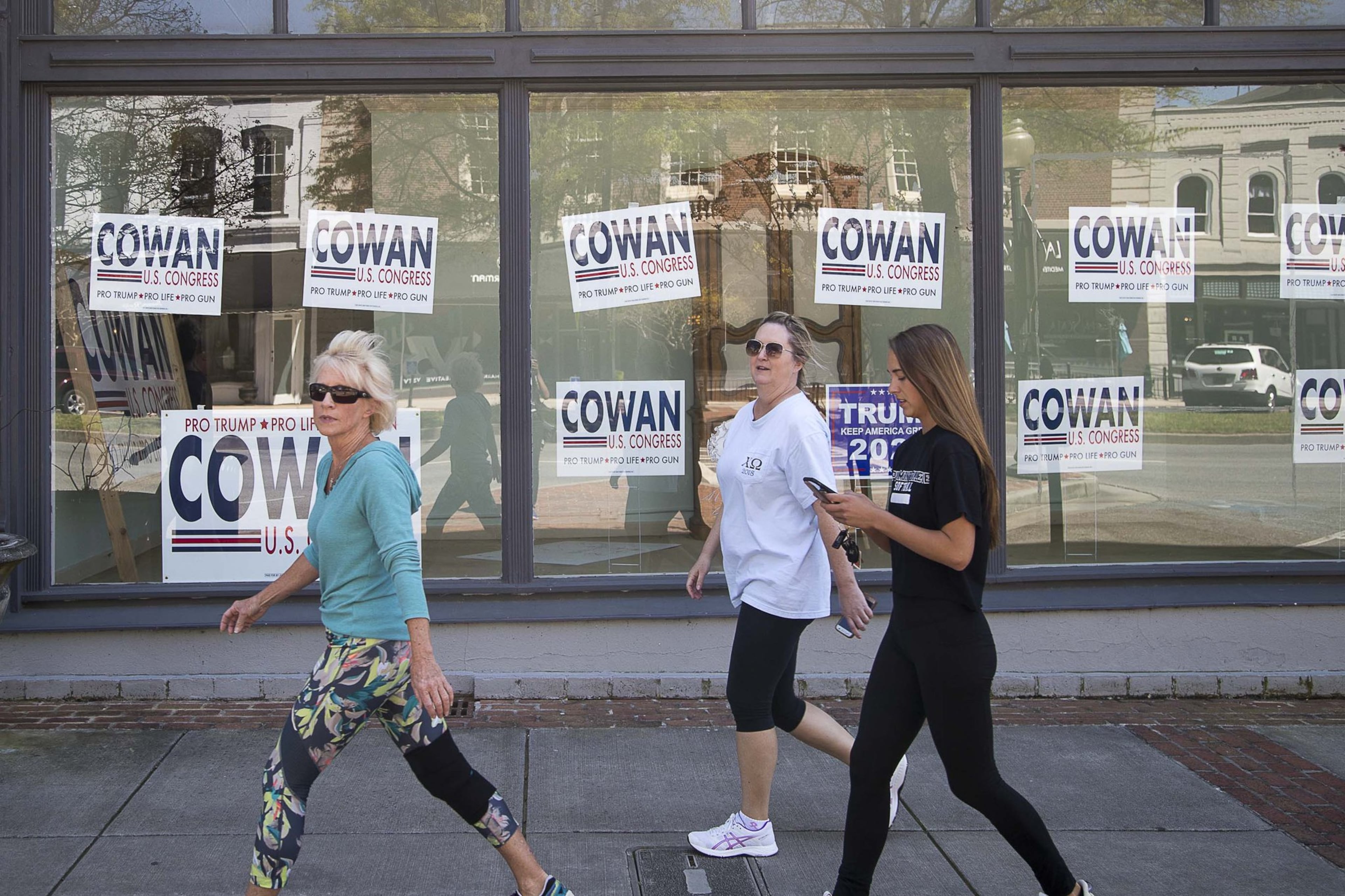 Signs promoting John Cowan’s campaign in the 14th Congressional District’s GOP primary are plastered in the window of a business on Broad Street in historic downtown Rome. Marjorie Taylor Greene defeated Cowan, a neurosurgeon, in a 2020 runoff. (AJC 2020)