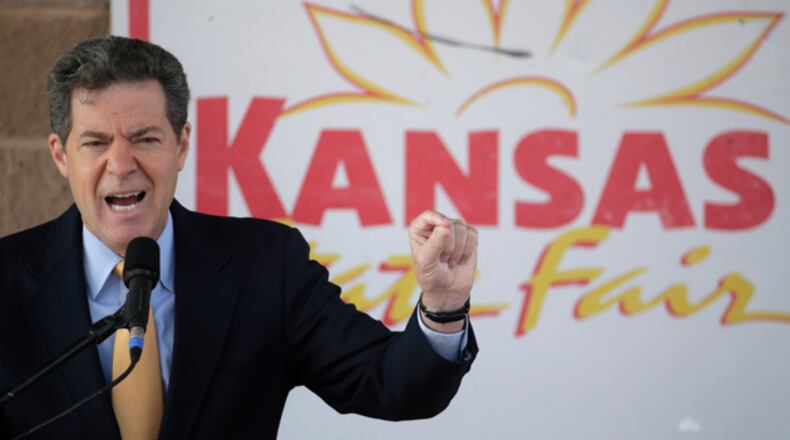 “My focus is to create a red-state model that allows the Republican (presidential) ticket to say, ‘See, we’ve got a different way, and it works,’ ” Kansas Gov. Sam Brownback said in announcing his state's experiment with supply-side economics. (AP)