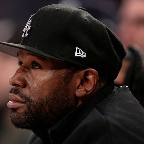 FILE - Boxer Floyd Mayweather Jr. looks on during the first half of an NBA basketball game, March 26, 2025, in New York. (AP Photo/Adam Hunger, File)