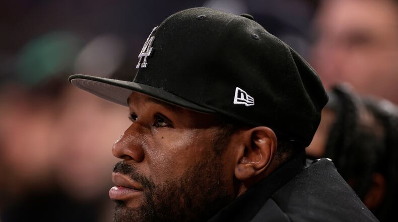 FILE - Boxer Floyd Mayweather Jr. looks on during the first half of an NBA basketball game, March 26, 2025, in New York. (AP Photo/Adam Hunger, File)