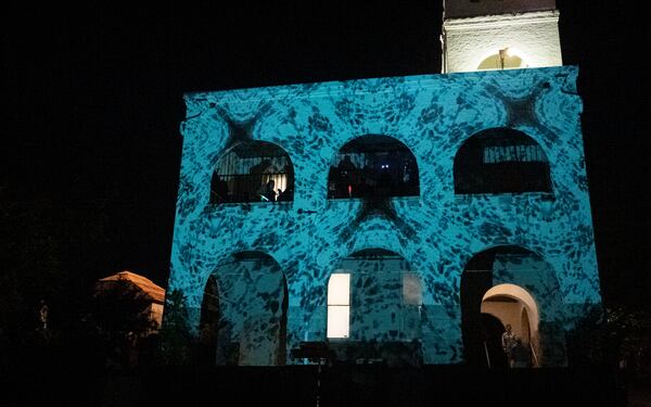 Oakland Cemetery's Bell Tower serves as a canvas for the flowing digital projections that multimedia artist Dr. Bojana Ginn uses on all four sides of the tower during "Illumine." (Photo by George Gomez / courtesy of Oakland Cemetery)
