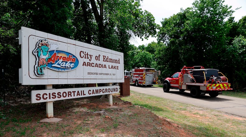 Edmond fire crews enter Scissortail Campground at Arcadia Lake in Edmond, Okla. on Monday, May 4, 2026 after a party shooting on Sunday evening. (AP Photo/Alonzo Adams)