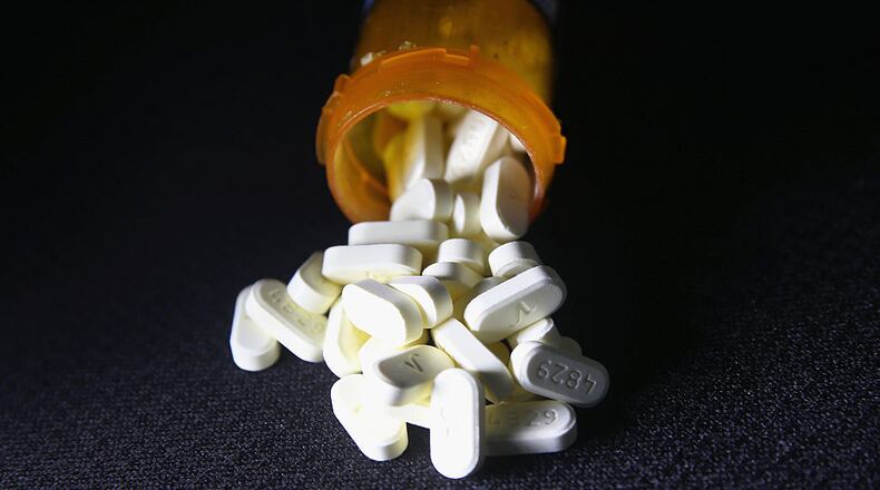 Norwich, Conn. - March 23, 2016: Oxycodone pain pills prescribed for a patient with chronic pain lie on display. Communities nationwide are struggling with the unprecedented opioid pain pill and heroin addiction epidemic. On March 15, the U.S. Centers for Disease Control and Prevention announced guidelines for doctors to reduce the amount of opioid painkillers prescribed in an effort to curb the epidemic. The CDC estimates that most new heroin addicts first became hooked on prescription pain medication before moving to heroin, which is stronger and cheaper. (Photo by John Moore/Getty Images)