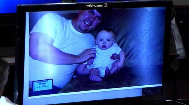 Family photo of Ross Harris and son Cooper, shown to jurors at hot-car murder trial. WSB-TV
