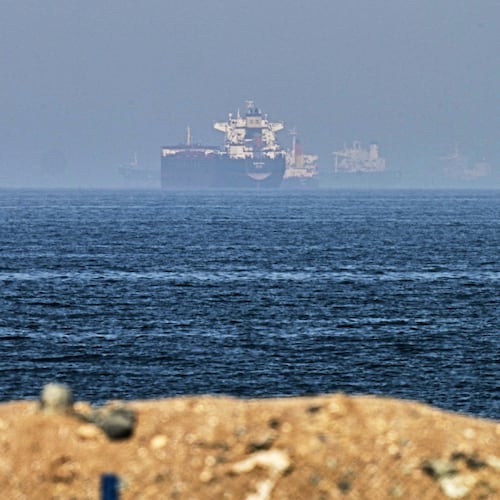 FILE - Cargo ships are seen at sea near the Strait of Hormuz, as viewed from a rocky shoreline near Khor Fakkan, United Arab Emirates, Friday, May 1, 2026. (AP Photo/Fatima Shbair, File)