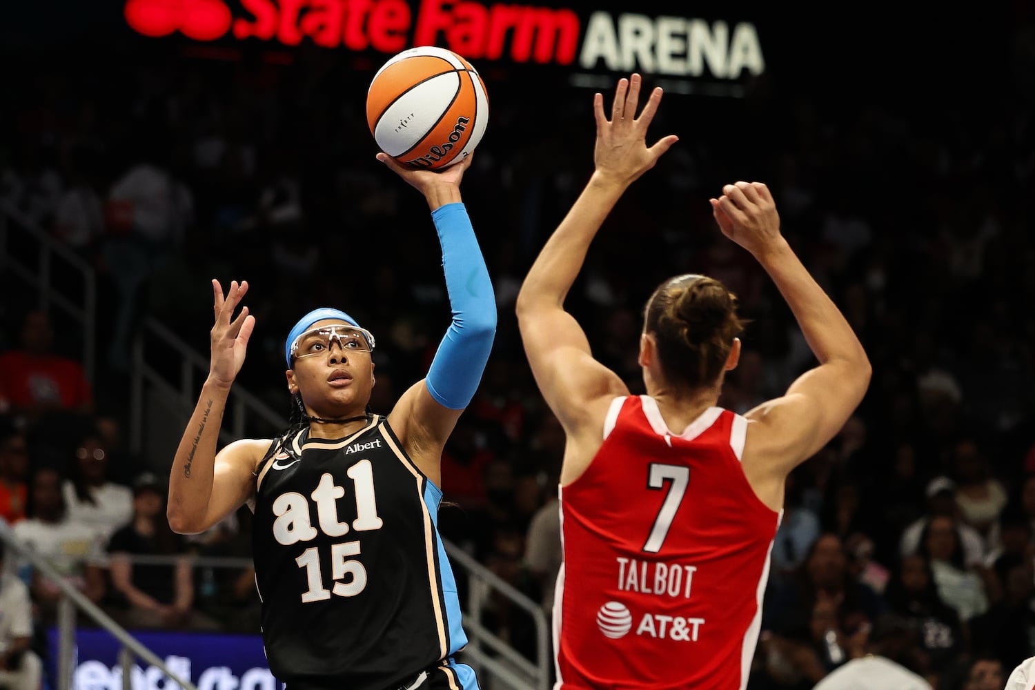 Dream guard Allisha Gray (left) shoots against Aces forward Stephanie Talbot during the first half Sunday, May 17, 2026, at State Farm Arena in Atlanta. (Colin Hubbard for the AJC) 