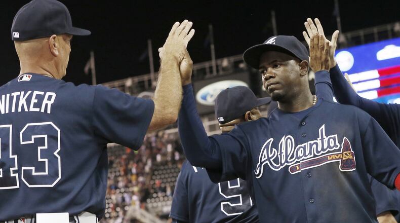 Adonis Garcia, right, performed at a high-enough level for most of the season to make the Braves cross third-base off their list of priority needs this winter. Starting pitching and catching top that list. (AP Photo/Jim Mone)