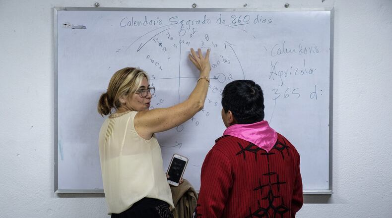 Rabbi Analia Bortz speaks with a Mayan religious leader about the sacred Mayan calendar. CONTRIBUTED BY CHRISTOPHER DILTS / AJWS