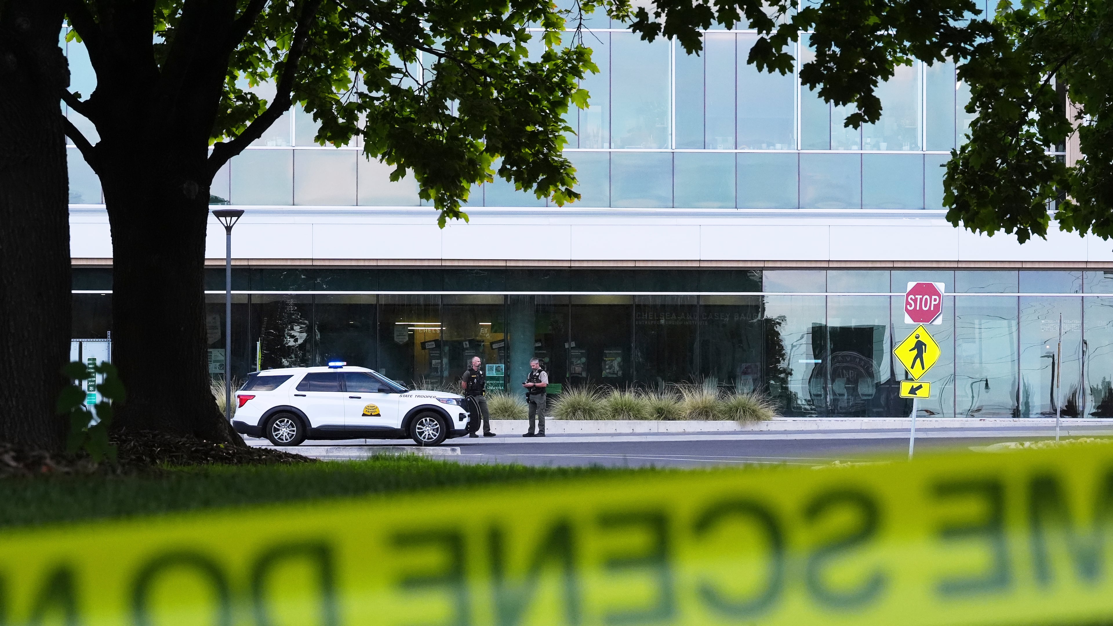 Law enforcement monitors the scene at Utah Valley University after Turning Point USA CEO and co-founder Charlie Kirk was shot and killed , Saturday, Sept. 13, 2025, in Orem, Utah. (AP Photo/Lindsey Wasson)