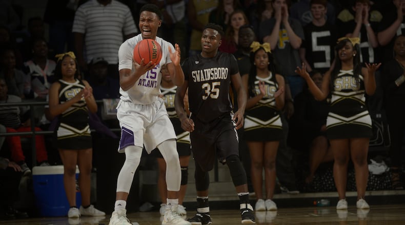South Atlanta senior Tyler Thornton (15) and Swainsboro sophomore Jamal Watkins (35) react to a play in the first half of their Class AA state championship game at Georgia Tech's McCamish Pavillion Saturday, March 11, 2017.