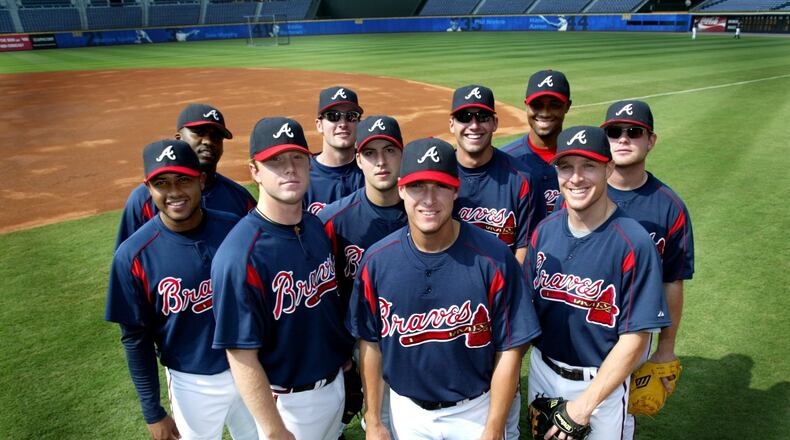 These players were among the Baby Braves in 2005: (left to right, front row: Andy Marte, Blaine Boyer, Kyle Davies (in middle), Kelly Johnson (center front), Pete Orr (far right), back row: Wilson Betemit, Ryan Langerhans (sunglasses), Jeff Francoeur (also w/sunglasses), Roman Colon (black man in back) and Brian McCann (sunglasses) on far right. (KEITH HADLEY/AJC file)