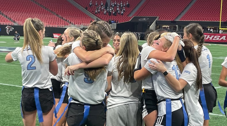 Pope players celebrate their 14-13 victory over Allatoona in the flag football Division 3 championship game at Mercedes-Benz Stadium on Dec. 13, 2023.