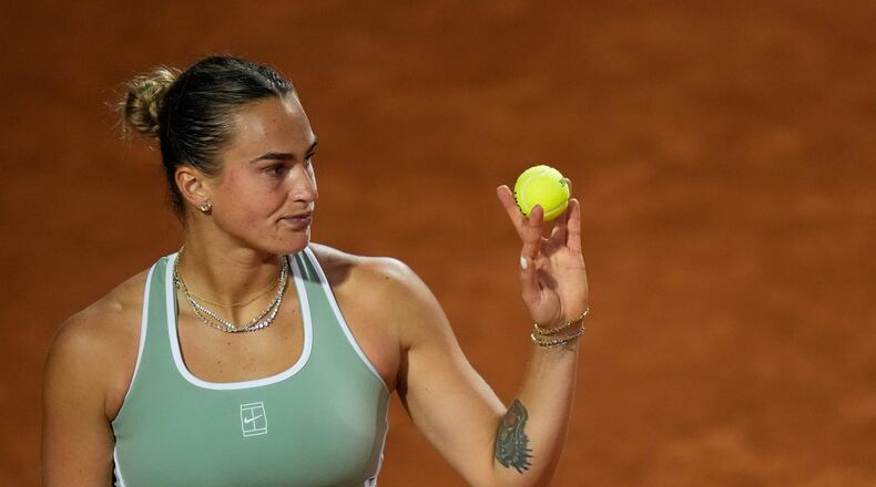 Aryna Sabalenka, of Belarus, prepares to serve the ball to Barbora Krejcikova, of Czechia, during their match at the Italian Open tennis tournament in Rome, Thursday, May 7, 2026. (AP Photo/Alessandra Tarantino)