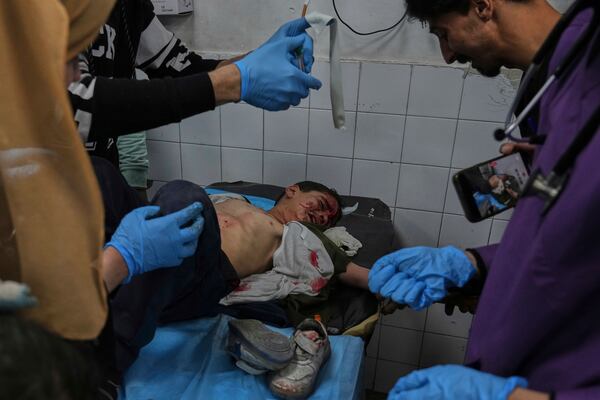 A Palestinian child injured in an Israeli airstrike receives treatment at the Baptist Hospital in Gaza City, Saturday, April 12, 2025. (AP Photo/Jehad Alshrafi)