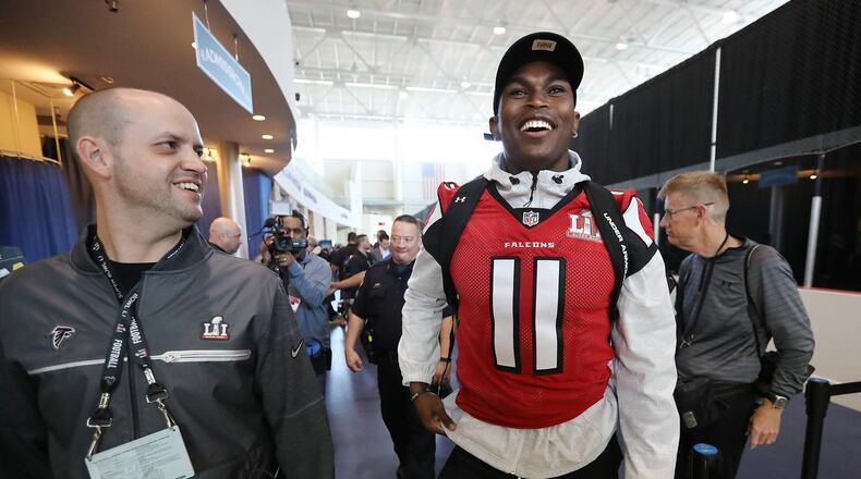 February 1, 2017, Houston: Falcons wide receiver Julio Jones shares a laugh with Brian Cearns, director of football communications, as they leave at the conclusion of Super Bowl media availability on Wednesday, Feb. 1, 2017, at the Memorial City Mall ice arena in Houston. Curtis Compton/ccompton@ajc.com