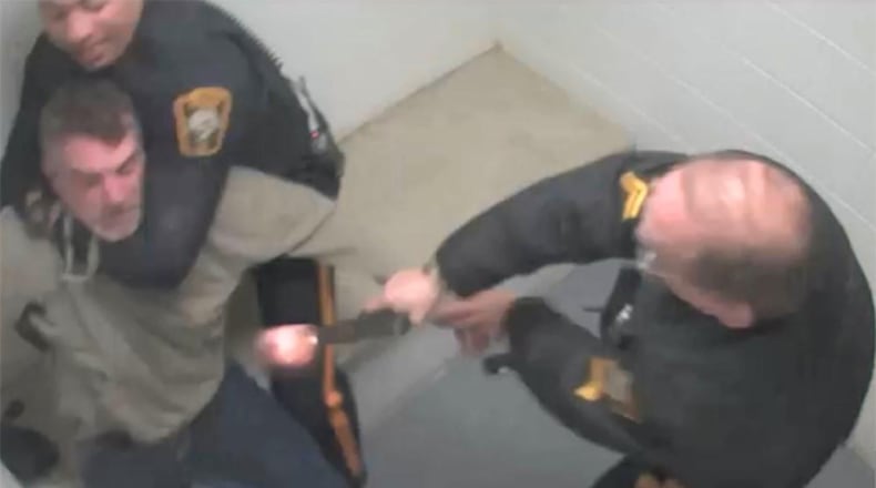 This screenshot from surveillance video released by the Bucks County District Attorney's Office shows the moment when a now-retired police officer with the New Hope Police Department in Pennsylvania mistook his service weapon for a Taser and shot a suspect in March 2019.