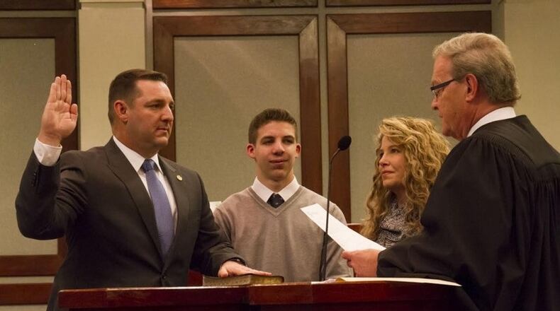 Forsyth County Sheriff Ron Freeman, shown at left, pressed Forsyth commissioners for authority to deal with “cut-through” drivers.