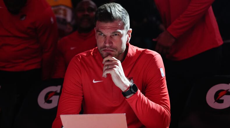 FILE - Portland Trail Blazers interim head coach Tiago Splitter listens during introductions before an NBA basketball game against the Brooklyn Nets, March 23, 2026, in Portland, Ore. (AP Photo/Jenny Kane, File)