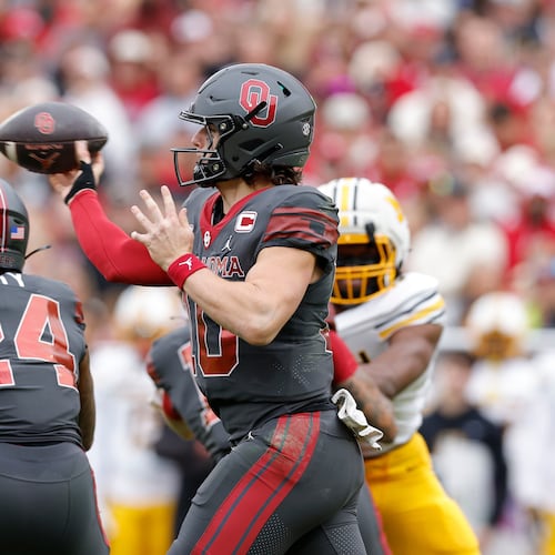Oklahoma quarterback John Mateer (10) passes against Missouri during the first half of an NCAA college football game Saturday, Nov. 22, 2025, in Norman, Okla. (AP Photo/Alonzo Adams)