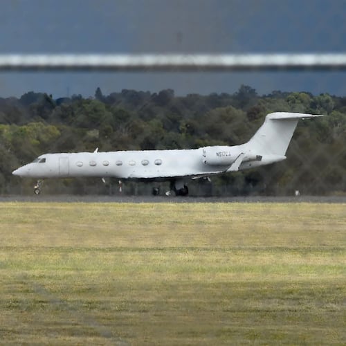 A jet carrying passengers from the hantavirus-stricken cruise ship MV Hondius arrives at RAAF Base Pearce in Perth, Australia, from the Netherlands on Friday, May 15, 2026. (Aaron Bunch/AAP Image via AP)