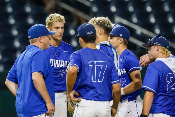 Etowah players gather on the mound around coach Greg Robinson during Game 1 of the Class 6A GHSA baseball state championship series Tuesday, May 26, 2026, at Gwinnett Field in Lawrenceville. (Miguel Martinez/AJC)