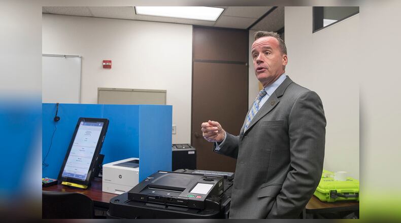 Chris Harvey, director of elections division for the Georgia Secretary of State, shows the new Georgia voting machines during a demonstration at the James H. "Sloppy" Floyd building in Atlanta, Monday, Sept. 16, 2019. (Alyssa Pointer/alyssa.pointer@ajc.com)