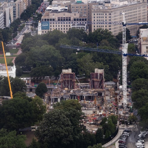 Construction continues on a helipad and the White House Ballroom on the South Lawn of the White House, Wednesday, Aug. 5, 2026, in Washington. (AP Photo/Tierney L. Cross)