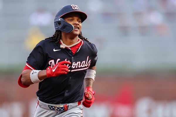 Washington Nationals' CJ Abrams reacts after hitting a solo home run in the first inning of a baseball game against the Atlanta Braves, Tuesday, May 13, 2025, in Atlanta. (AP Photo/Colin Hubbard)