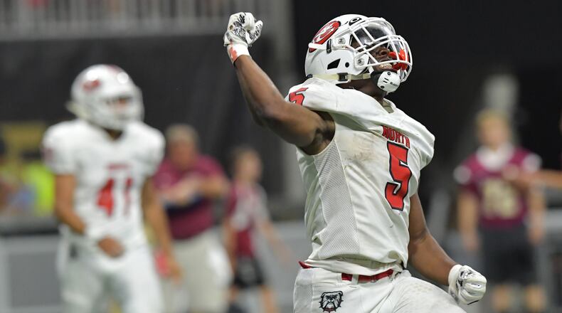 North Gwinnett running back Tyler Goodson (5) celebrates in the second half during the Corky Kell Classic game Saturday, Aug. 18, 2018, at Mercedes-Benz Stadium in Atlanta.