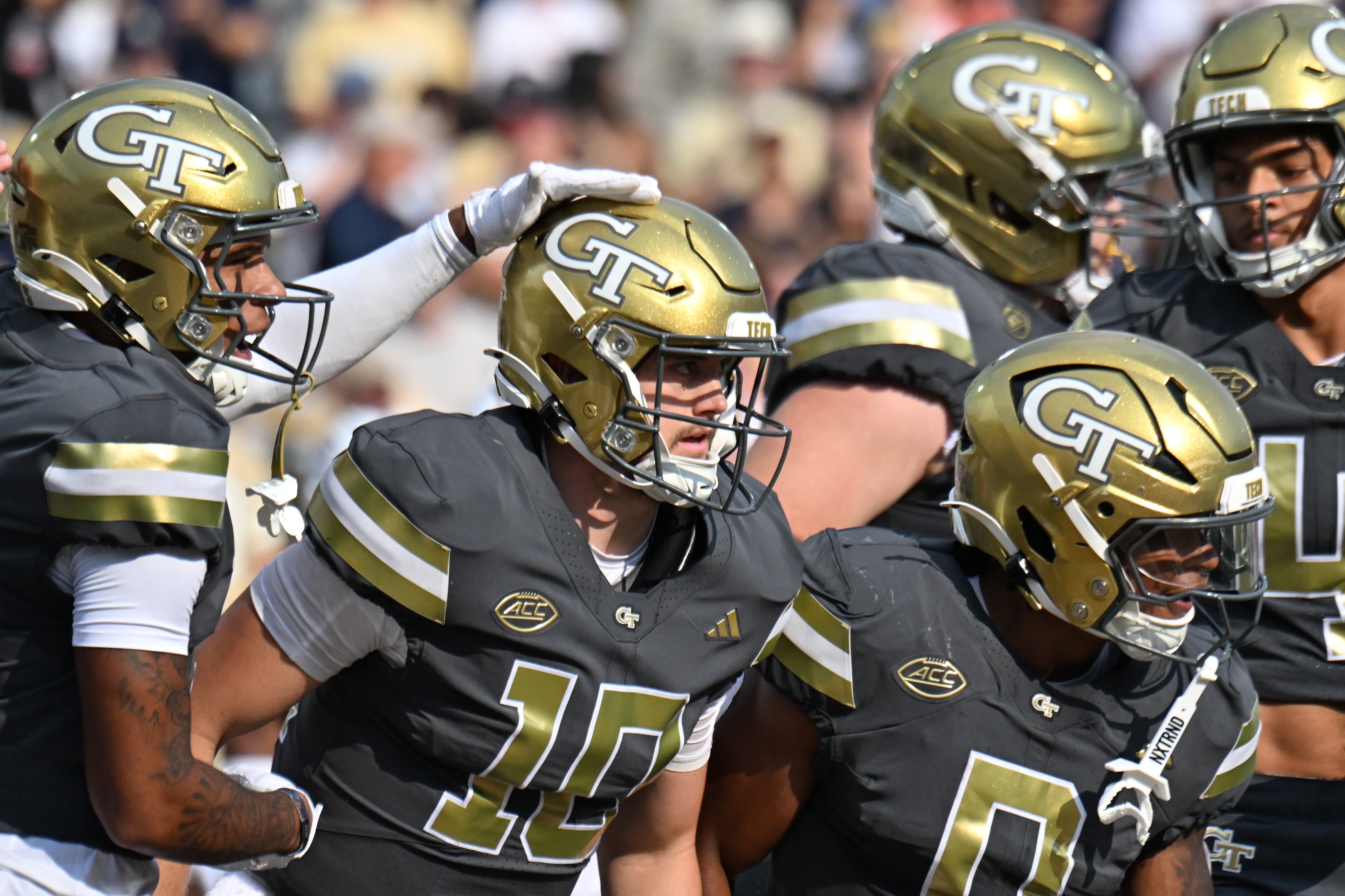 Georgia Tech quarterback Haynes King celebrates with teammates after scoring a touchdown during the first half of an NCAA college football game at Georgia Tech's Bobby Dodd Stadium, Saturday, Sept. 20, 2025 in Atlanta. (Hyosub Shin/AJC)