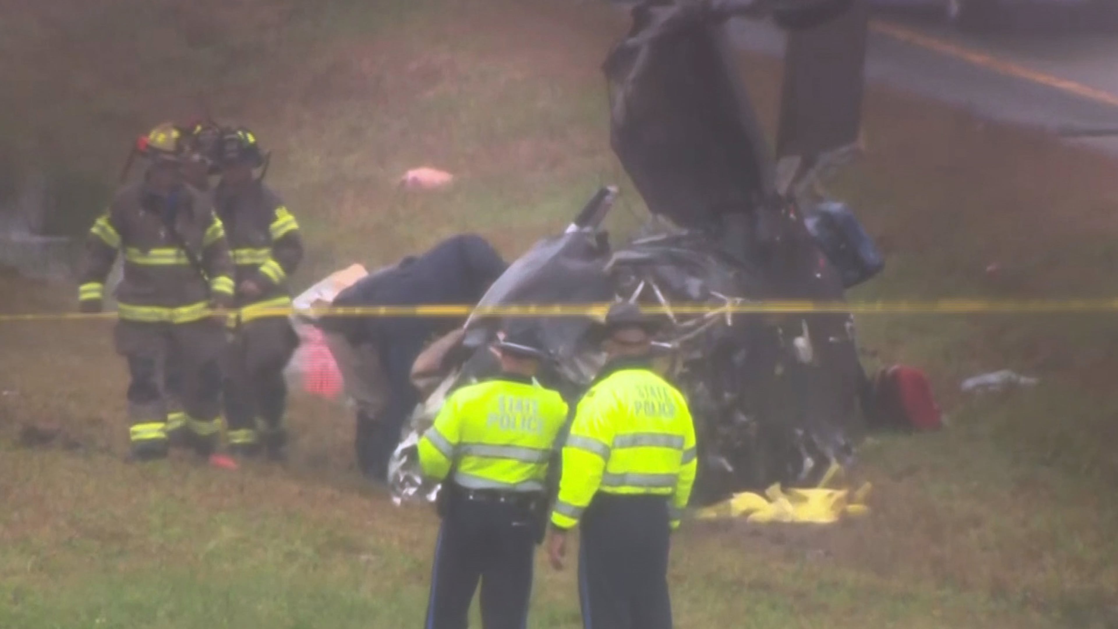 This image made from video provided by WCVB-TV, shows the scene after a small plane crashed onto a highway in Dartmouth, Mass., Monday Oct. 13, 2025. (WCVB-TV via AP)