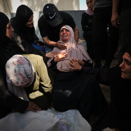 Mourners attend the funeral of Palestinians who were killed in an Israeli army strike on a cafe at the Gaza port the previous day, at Shifa Hospital in Gaza City, Wednesday, Aug. 19, 2026. (AP Photo/Jehad Alshrafi)