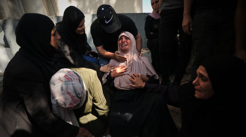 Mourners attend the funeral of Palestinians who were killed in an Israeli army strike on a cafe at the Gaza port the previous day, at Shifa Hospital in Gaza City, Wednesday, Aug. 19, 2026. (AP Photo/Jehad Alshrafi)