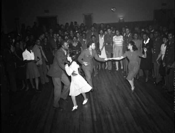 "High Hat" dance and party on Auburn Avenue in Atlanta, Jan. 21, 1943. Photo shoot commissioned by fashion and home-goods mail-order merchandizer, Chicago Mail Order Co., owned by Alden's. (Lane Brothers Commercial Photographers Photographic Collection, 1920-1976. Photographic Collection, Special Collections and Archives, Georgia State University Library.)