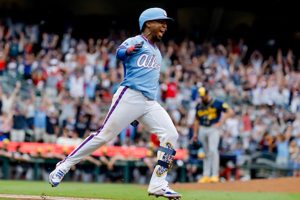 Ozzie Albies celebrates his walk-off two-run homer against the Brewers last weekend. (Erik S. Lesser/AP)