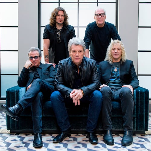 FILE - Members of Bon Jovi front row from left, Tico Torres, Jon Bon Jovi, David Bryan, back row from left, Phil X, and Hugh McDonald pose for a portrait in New York on Oct. 19, 2016. (Photo by Drew Gurian/Invision/AP, File)