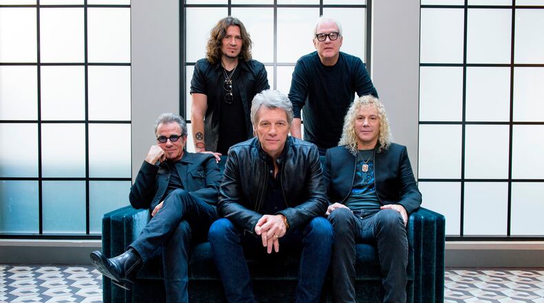 FILE - Members of Bon Jovi front row from left, Tico Torres, Jon Bon Jovi, David Bryan, back row from left, Phil X, and Hugh McDonald pose for a portrait in New York on Oct. 19, 2016. (Photo by Drew Gurian/Invision/AP, File)