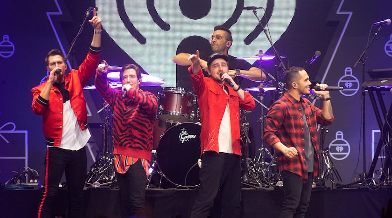 James Maslow, from left, Kendall Schmidt , Carlos Pena Jr., and Logan Henderson of Big Time Rush perform in concert during Q102's iHeartRadio Jingle Ball at the Wells Fargo Center on Monday, Dec. 13, 2021, in Philadelphia. (Photo by Owen Sweeney/Invision/AP)