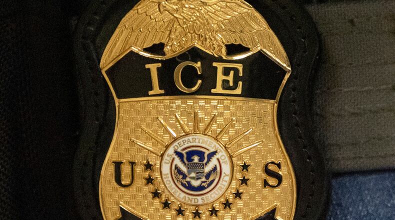 FILE - A federal agent wears an Immigration and Customs Enforcement badge in New York, June 10, 2025. (AP Photo/Yuki Iwamura, File)