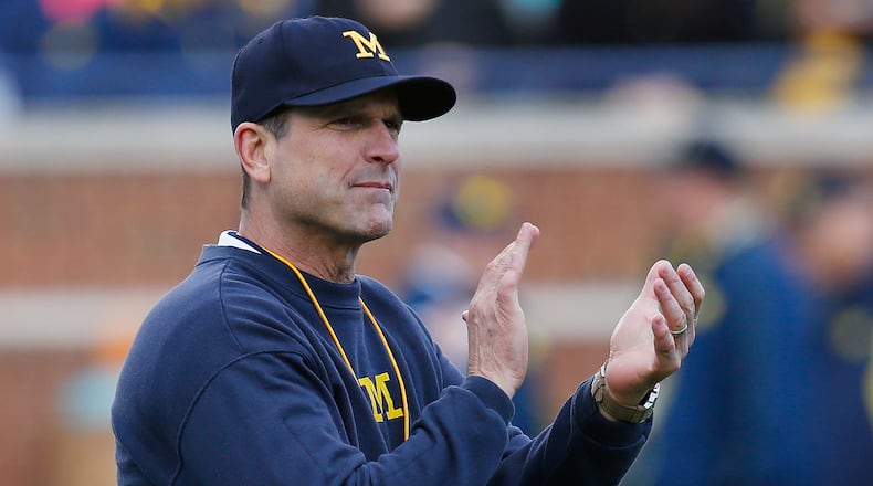 Michigan coach Jim Harbaugh says the camps are "good for prospective student-athletes, fans, coaches and competition."