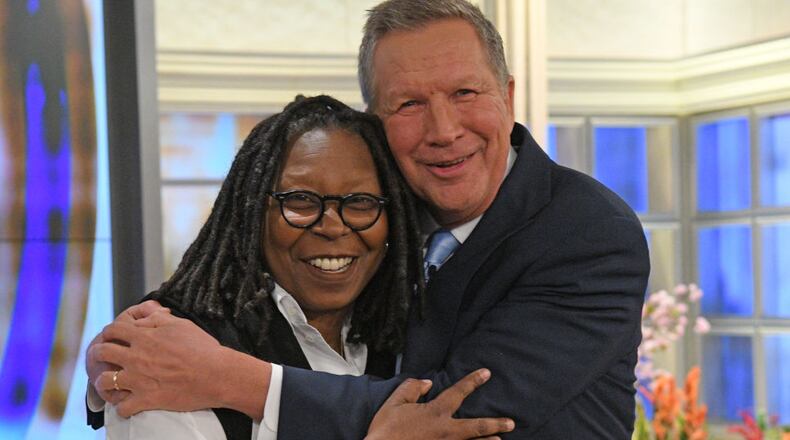 Ohio Gov. John Kasich and Whoopi Goldberg embrace during Thursday's airing of "The View" on ABC.