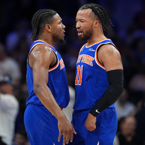 New York Knicks' Miles McBride, left, and Jalen Brunson celebrate during the first half of Game 4 against the Philadelphia 76ers in a second-round NBA basketball playoffs series Sunday, May 10, 2026, in Philadelphia. (AP Photo/Matt Slocum)