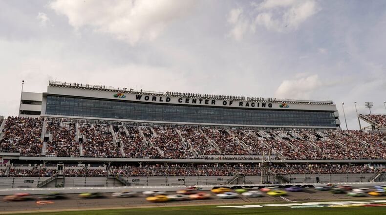 FILE - Cars move during the NASCAR Daytona 500 auto race at Daytona International Speedway, Feb. 15, 2026, in Daytona Beach, Fla. (AP Photo/Nigel Cook, File)