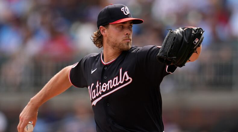 Washington Nationals pitcher Jake Irvin works in the first inning of a baseball game against the Atlanta Braves, Saturday, May 23, 2026, in Atlanta. (AP Photo/Mike Stewart)